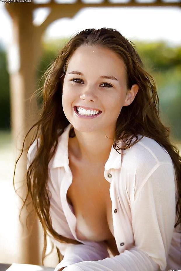 Down her shirt.